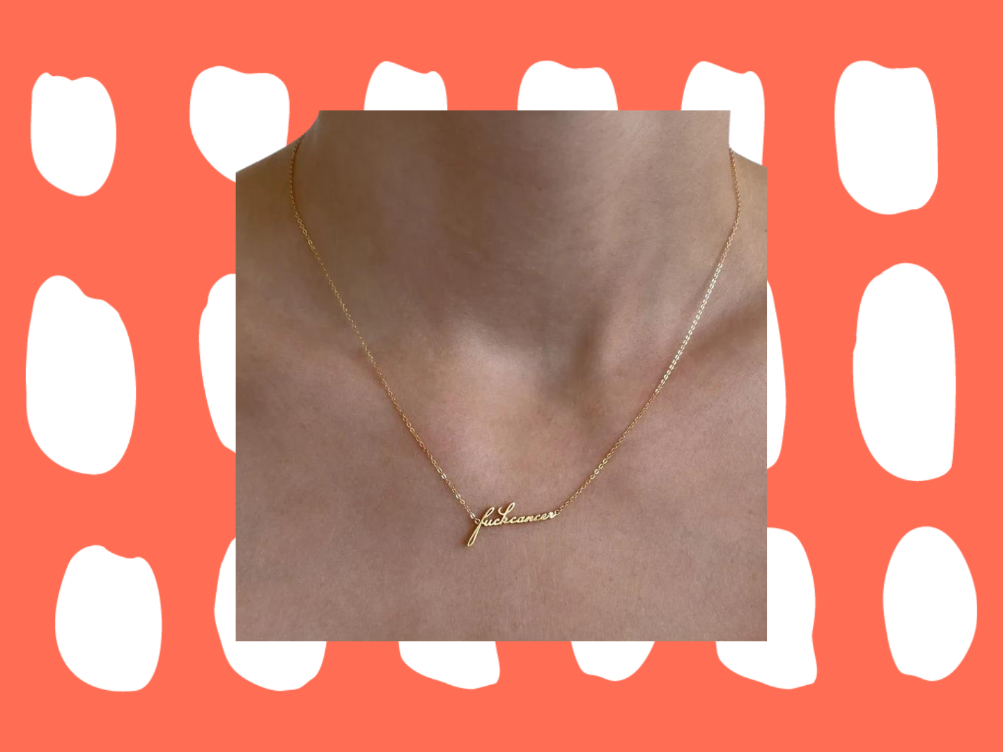 A gold chain necklace around a necklace that reads "fuck cancer" in cursive.